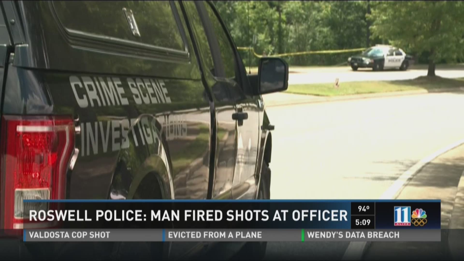 Roswell officer shot at while on patrol, suspect in custody