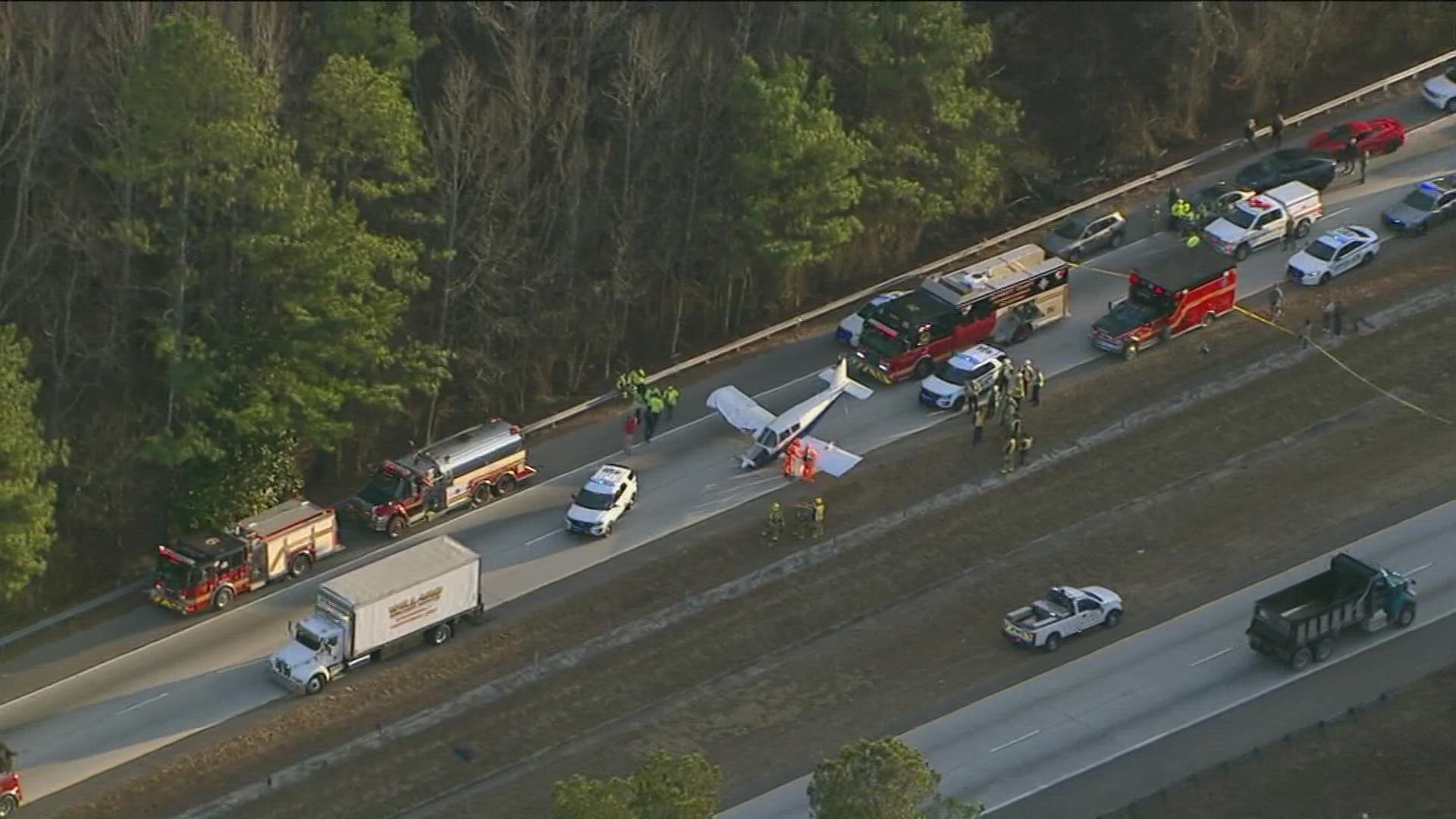 The Georgia State Patrol is on scene investigating after the plane landed on I-985 in Buford.