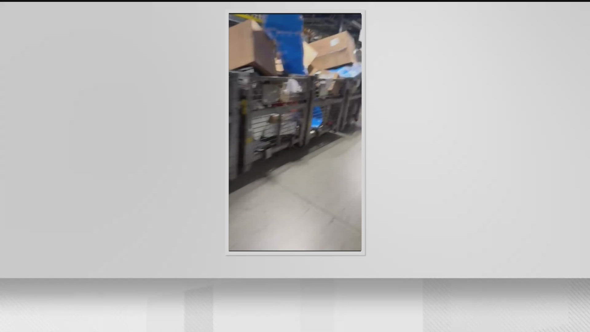 Video from inside the Palmetto mail facility released by a worker shows thousands of pieces of mail parked in countless bins, waiting for workers to get it moving.