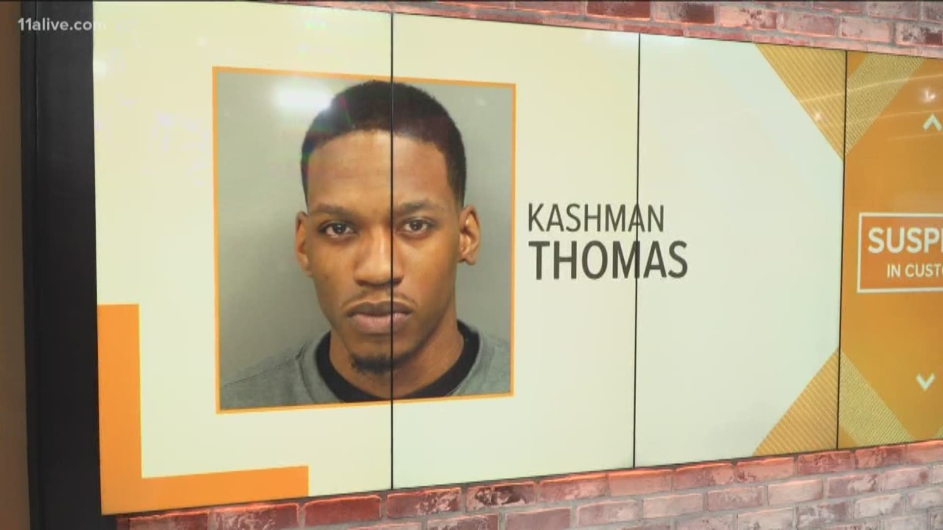 Kashman Thomas, 22, was arrested Tuesday after turning himself over to police at the Cobb County Jail, according to police.