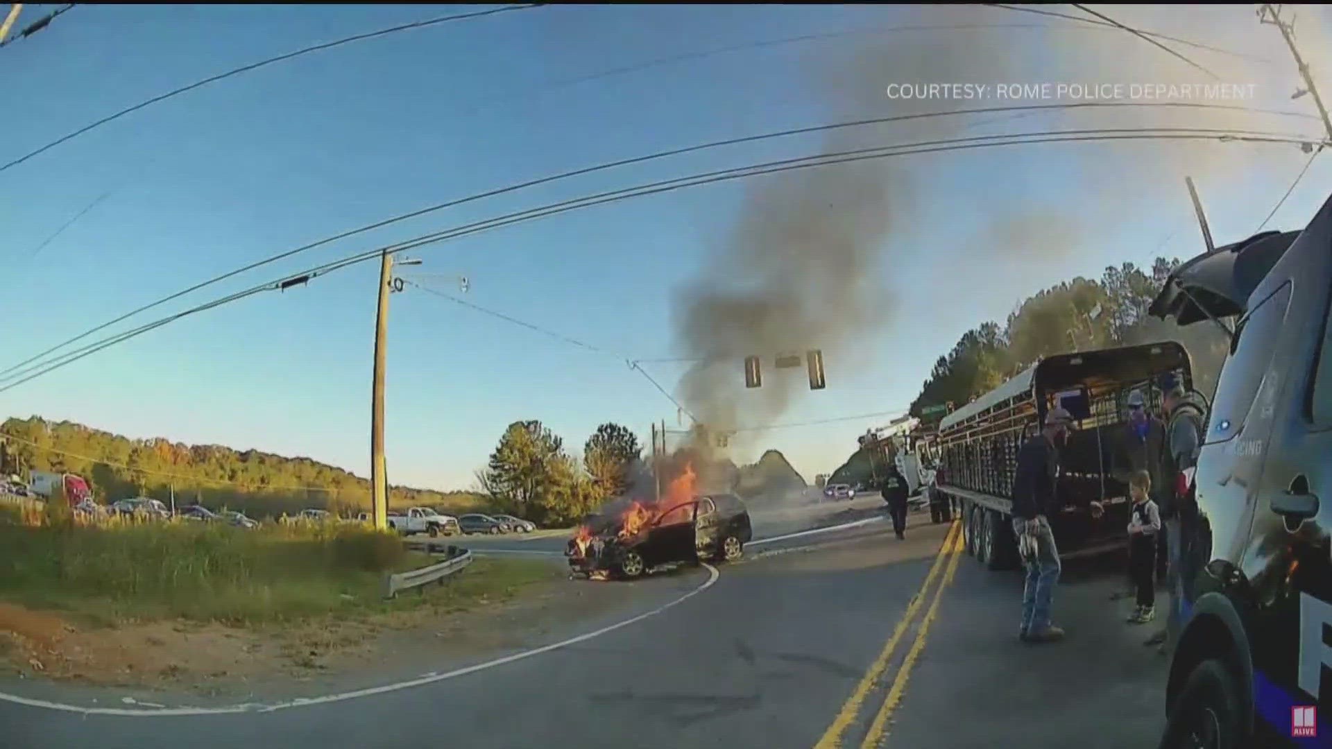 Body camera video was released of a mother and her child being pulled from a burning car following a multi-vehicle accident in Rome on Wednesday, according to police