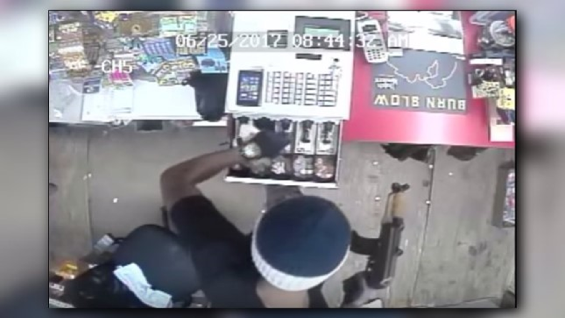 Video | Armed robbery suspect caught on camera toting an assault rifle ...