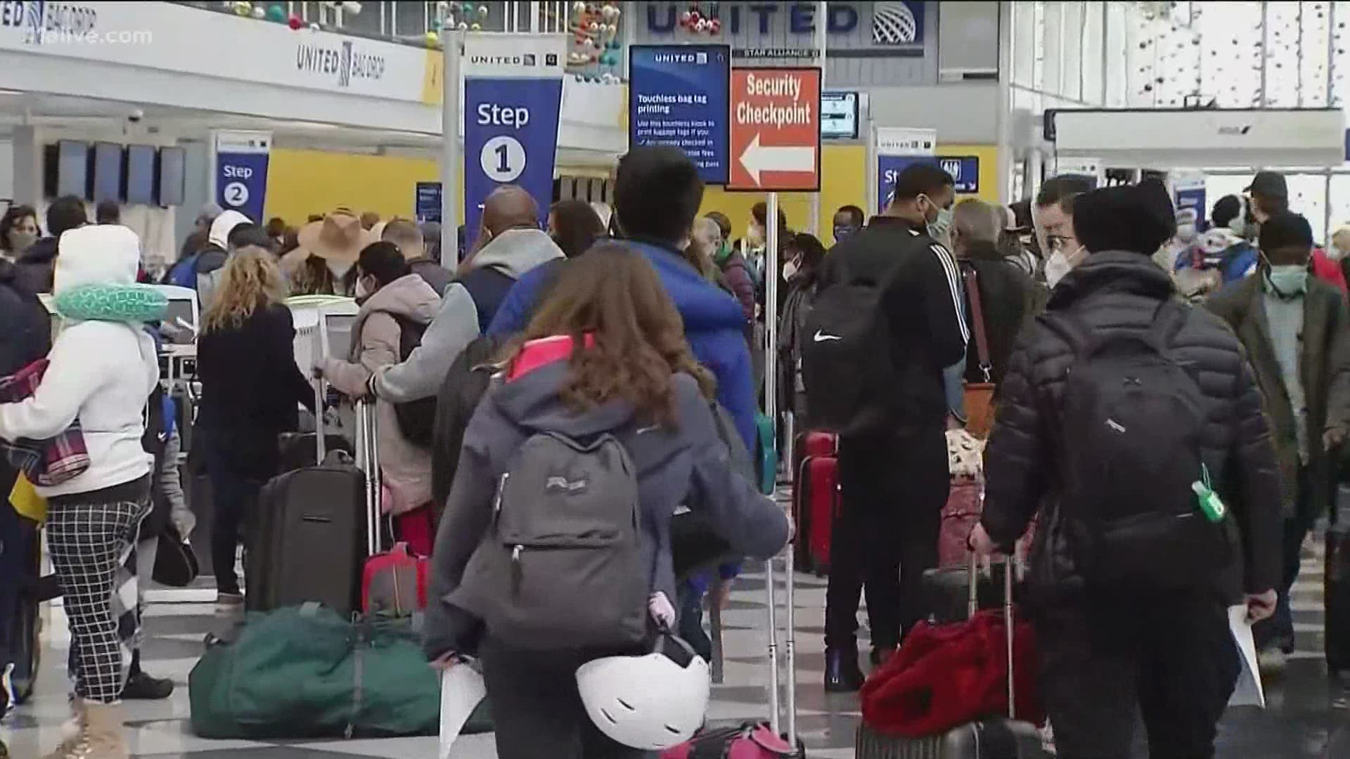 Travelers said they won't let the weather or concern over the CDC's warnings about the pandemic stop them from traveling for the Christmas holiday.