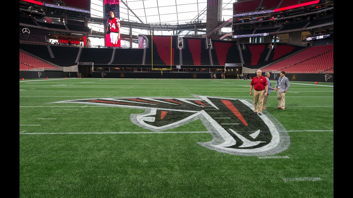 Mercedes-Benz Stadium seen through the Olympic ring of The Flair