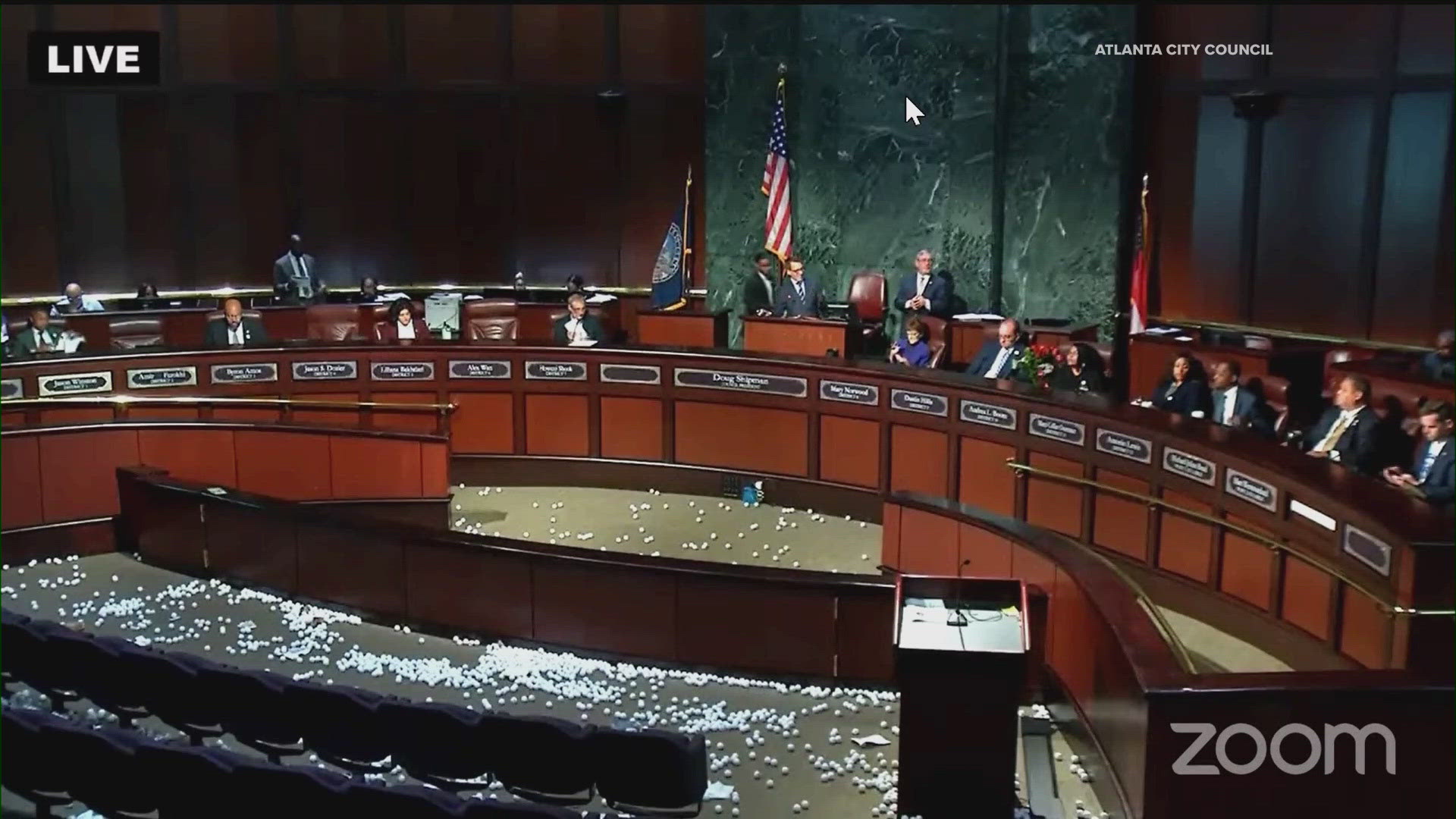 A group of protesters said they dropped thousands of ping-pong balls inside the chamber where the Atlanta City Council met on Monday.