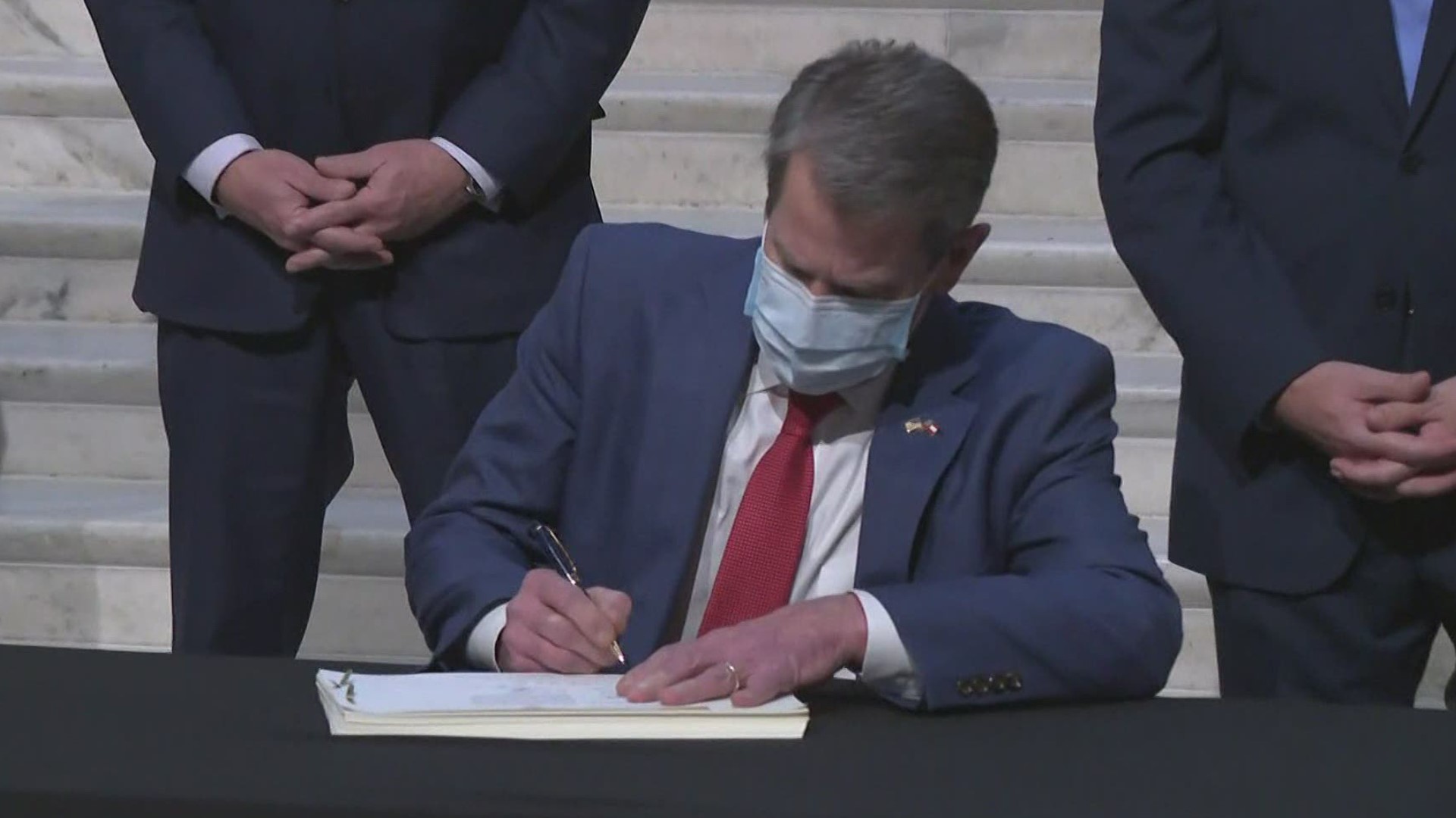Gov. Kemp joined legislative leaders in signing the budget Monday.