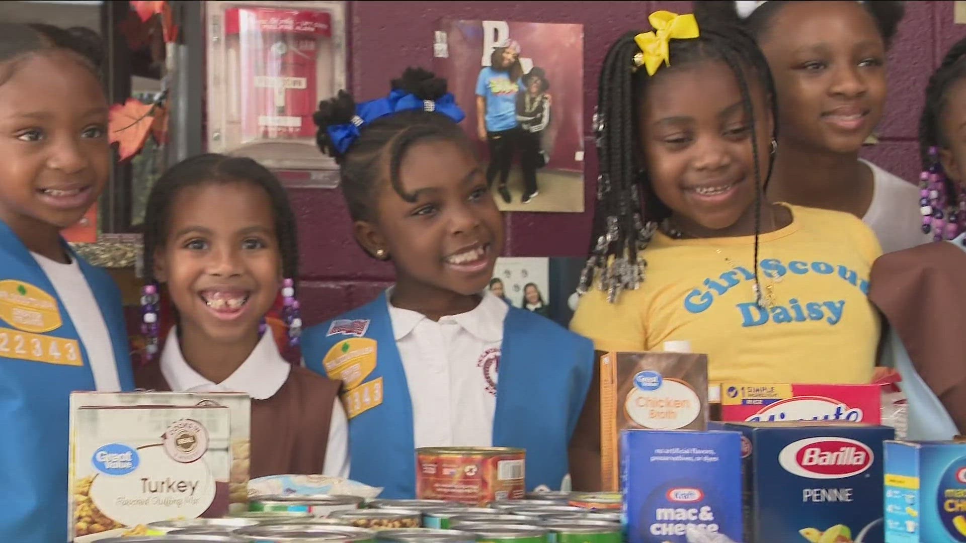 Troop leader Felicia Turner says the troop is earning their food drive badge.