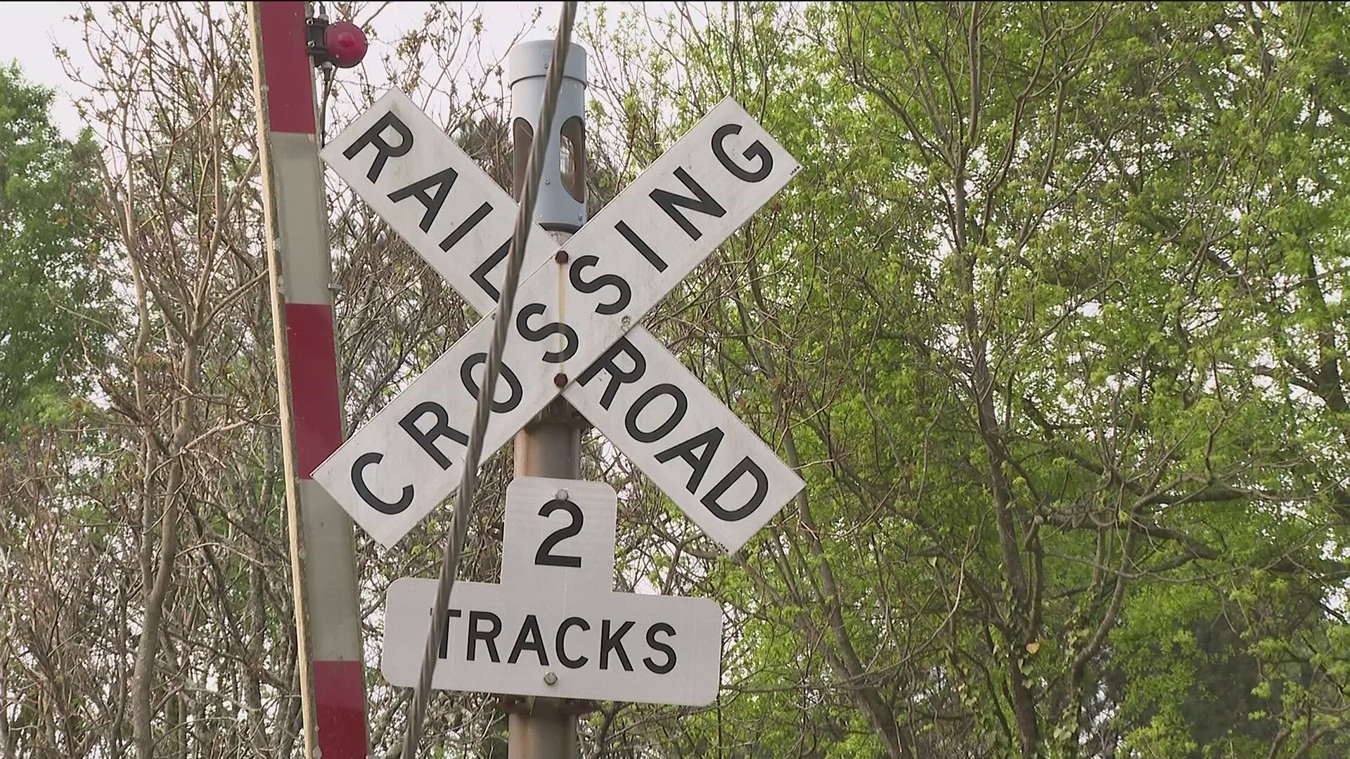 The residents are pleading with the rail company to keep its trains from blocking crossing for days.
