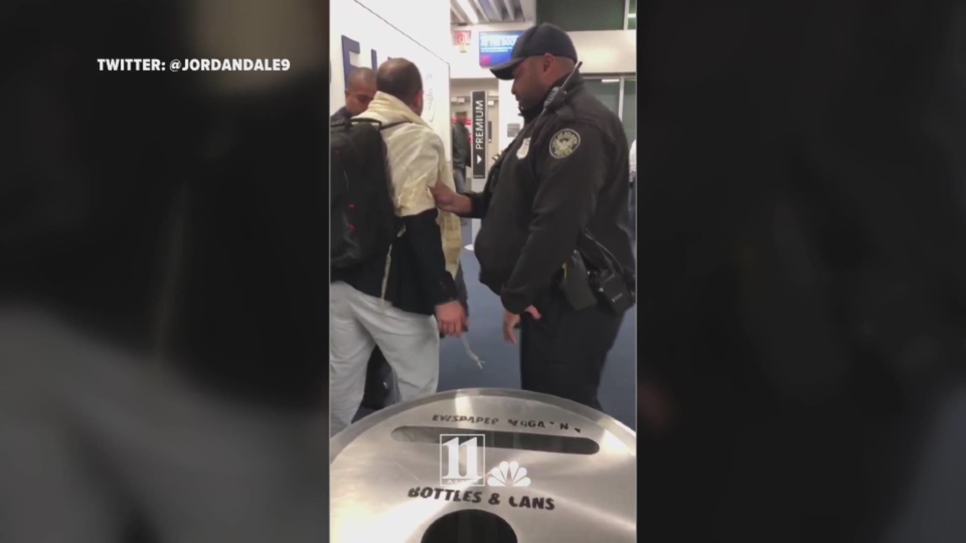 A person near the gate recorded the struggle with police as officers tried to arrest the man after the D.C. to Atlanta flight.