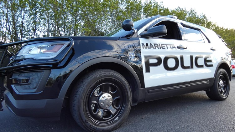 Marietta police shoot man who they say pointed rifle at officers while on the roof of home