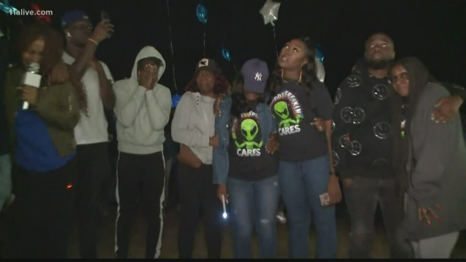 Many gathered in Gwinnett County at Harbins Park Thursday night for a vigil to honor his life with candlelight and prayers as they shared their grief.