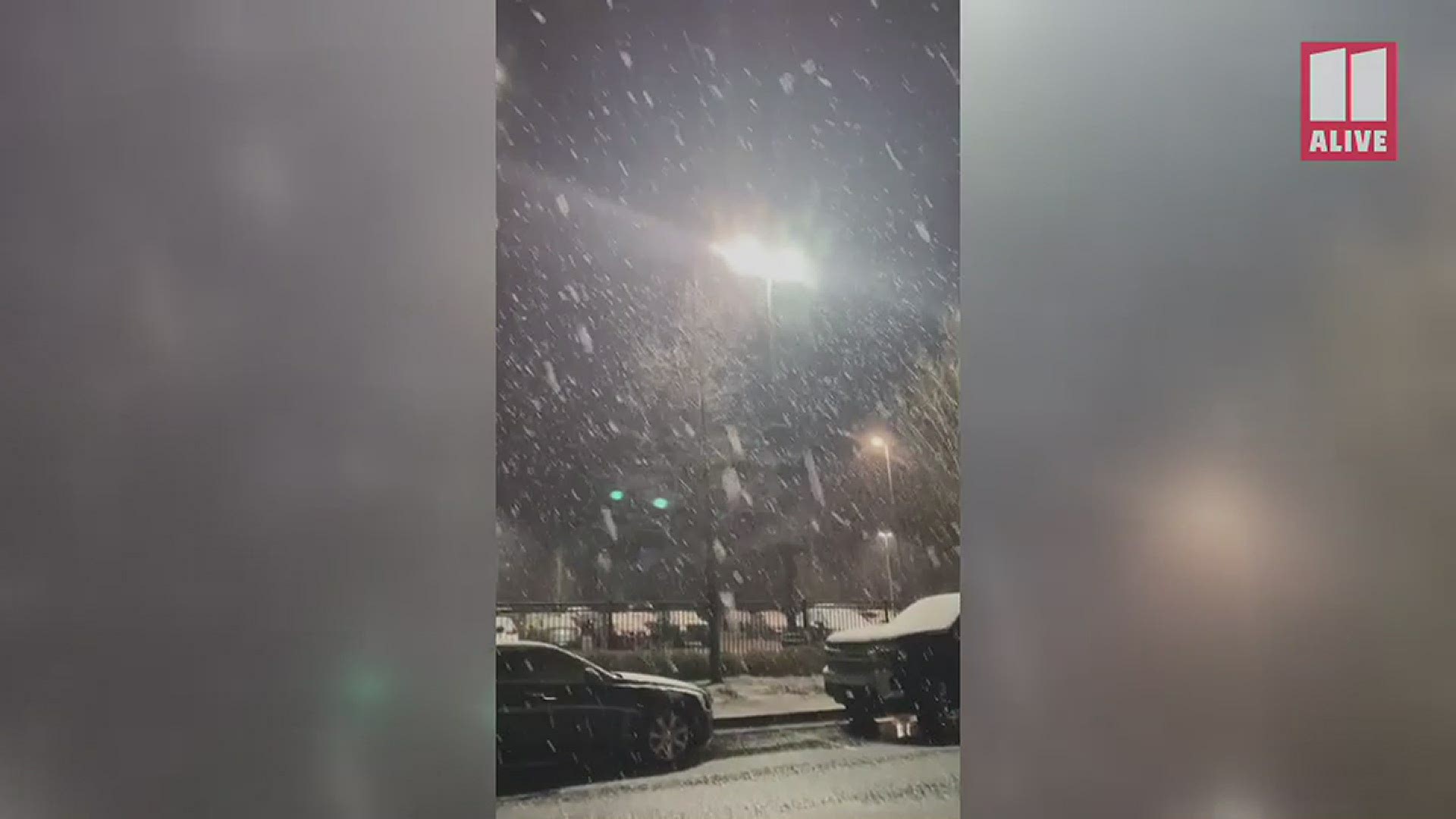 Priscilla Joyner captured this video of snow in Lawrenceville, Georgia where there's actually snow collecting on cars in a nearby parking lot.