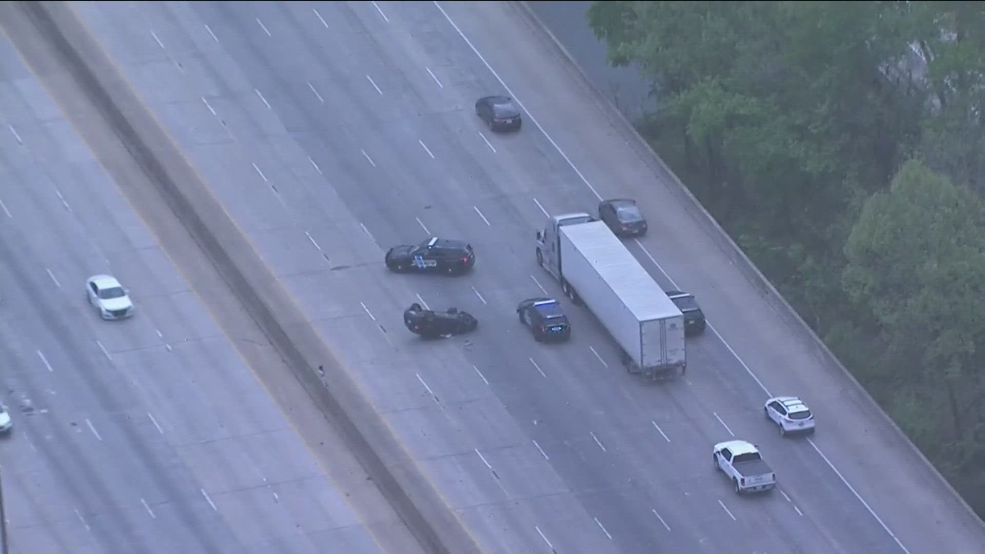 GDOT511 shows the overturned car on I-285 west at Powers Ferry.