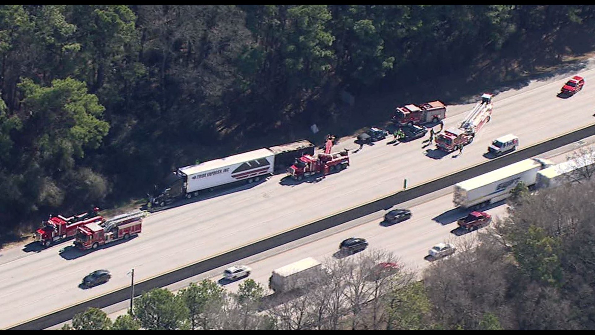 Trapped dump truck driver rescued after crashing into tractor-trailer ...