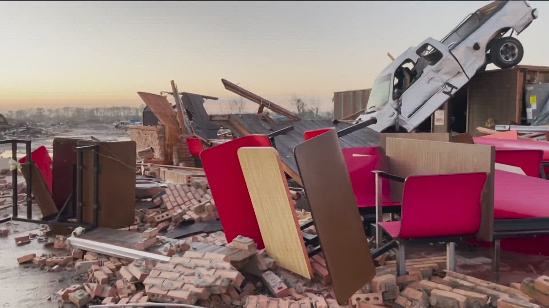 Daylight revealed houses reduced to piles of rubble, cars flipped on their sides and trees stripped of their branches.