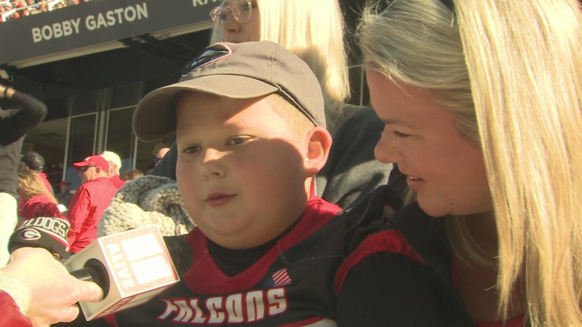 Before the Georgia Tech game, a little boy held a sign saying all he wanted for Christmas was to meet Jordan Davis. Davis made his wish come true.