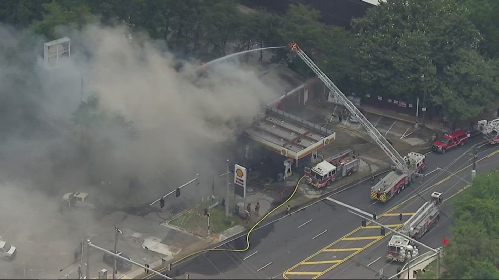 11Alive SkyTracker flew over a shell gas station along Northside Drive, where heavy smoke can be seen as firefighters work to extinguish the flames.