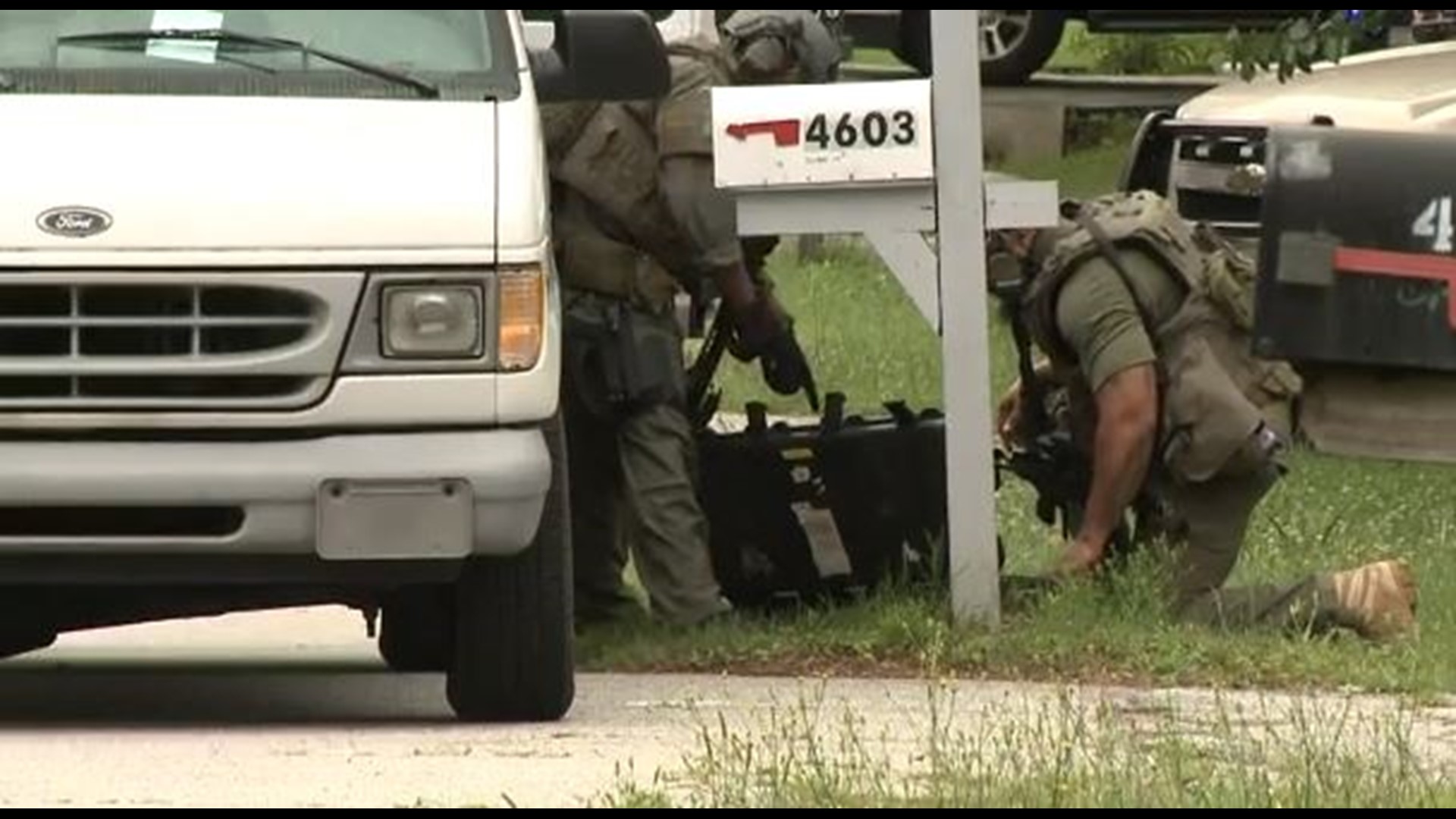 Residents escape after armed man enters home, barricades himself inside ...