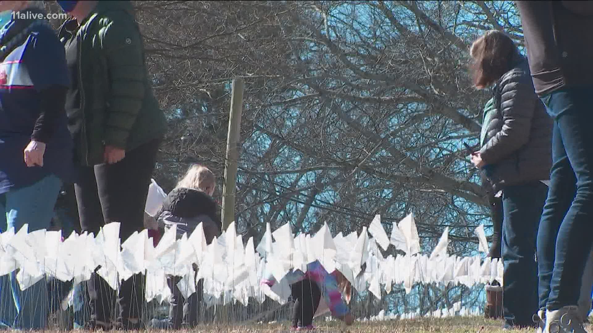 Each flag represents one of the 14,629 victims.