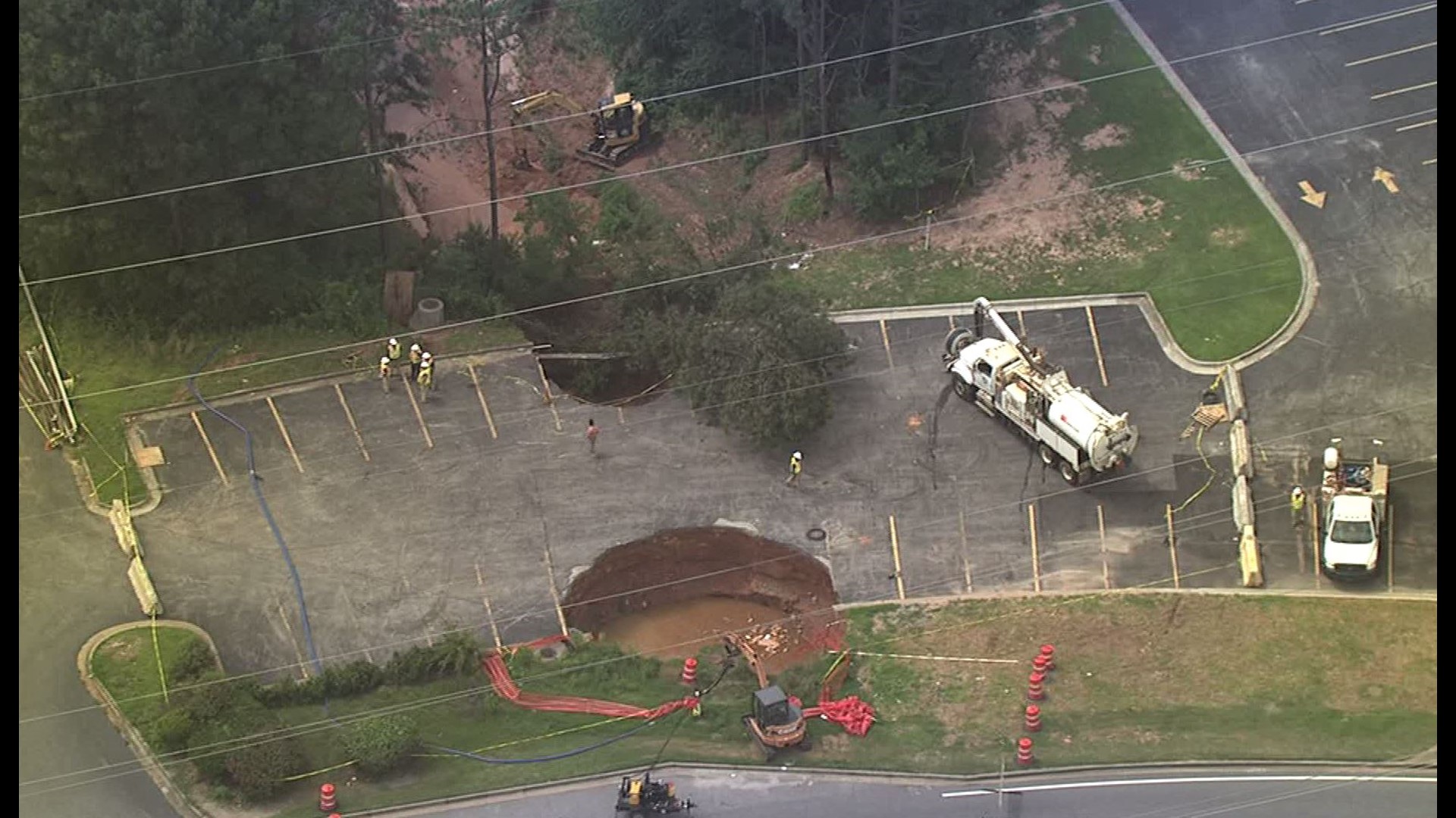 Massive sinkholes destroy metro Atlanta parking lot