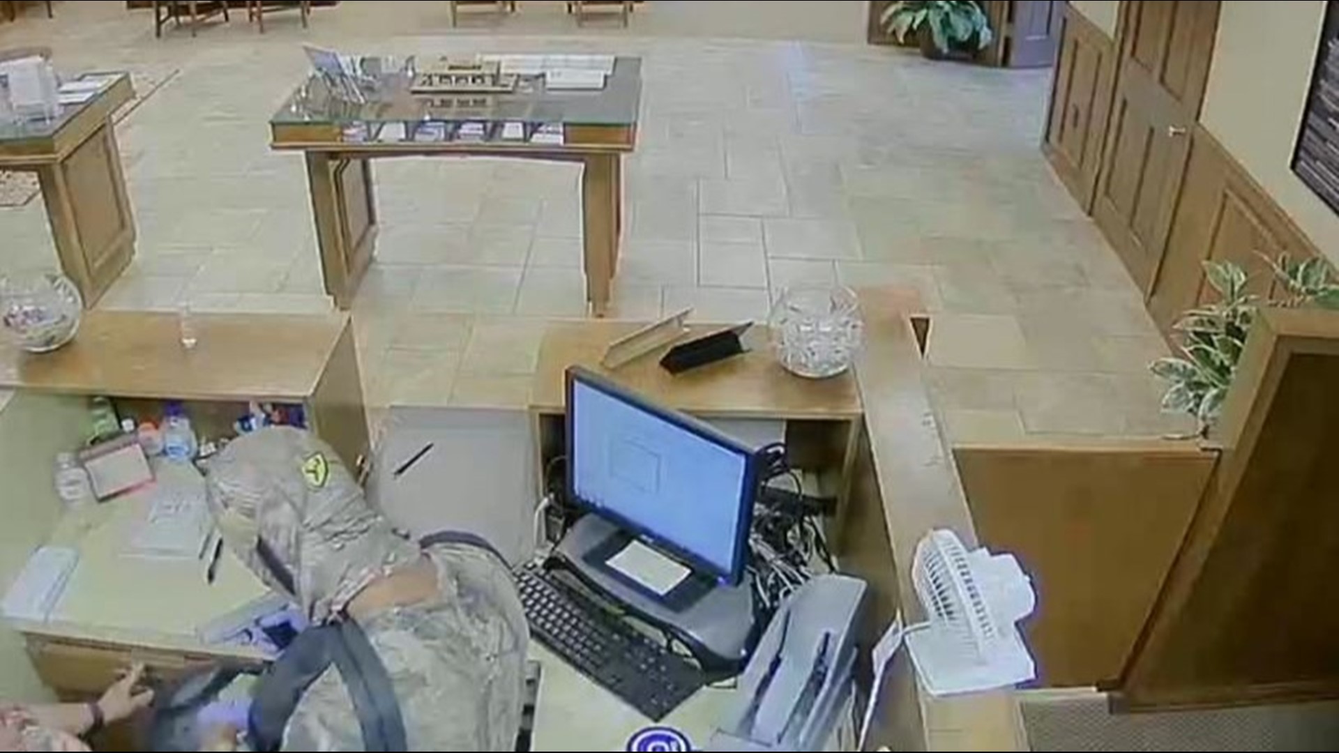 FBI releases new video, photos of suspect wanted in violent Woodbury bank robbery