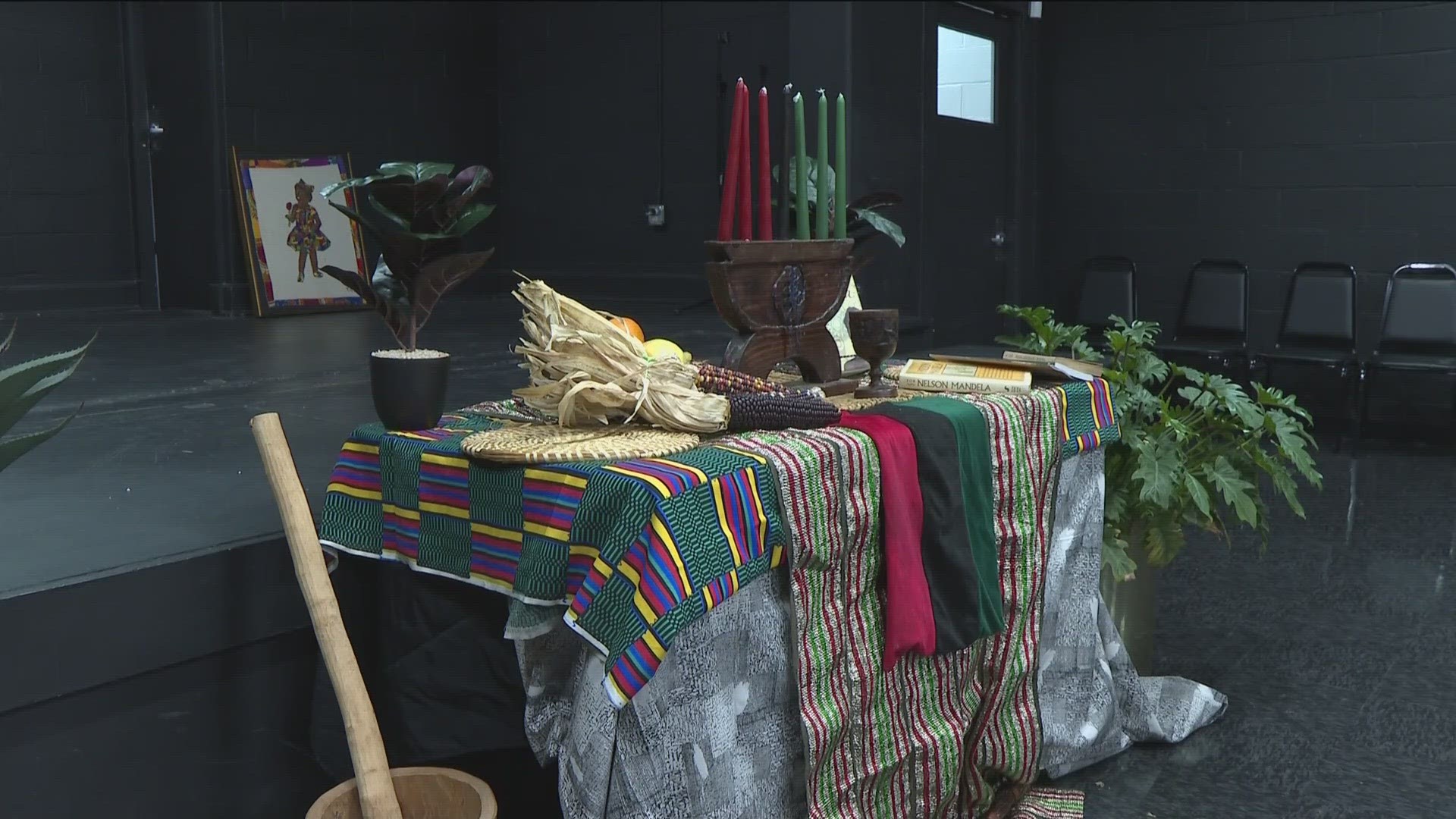 In the black box theater of the Artsxchange in East Point, the traditional altar is already set.