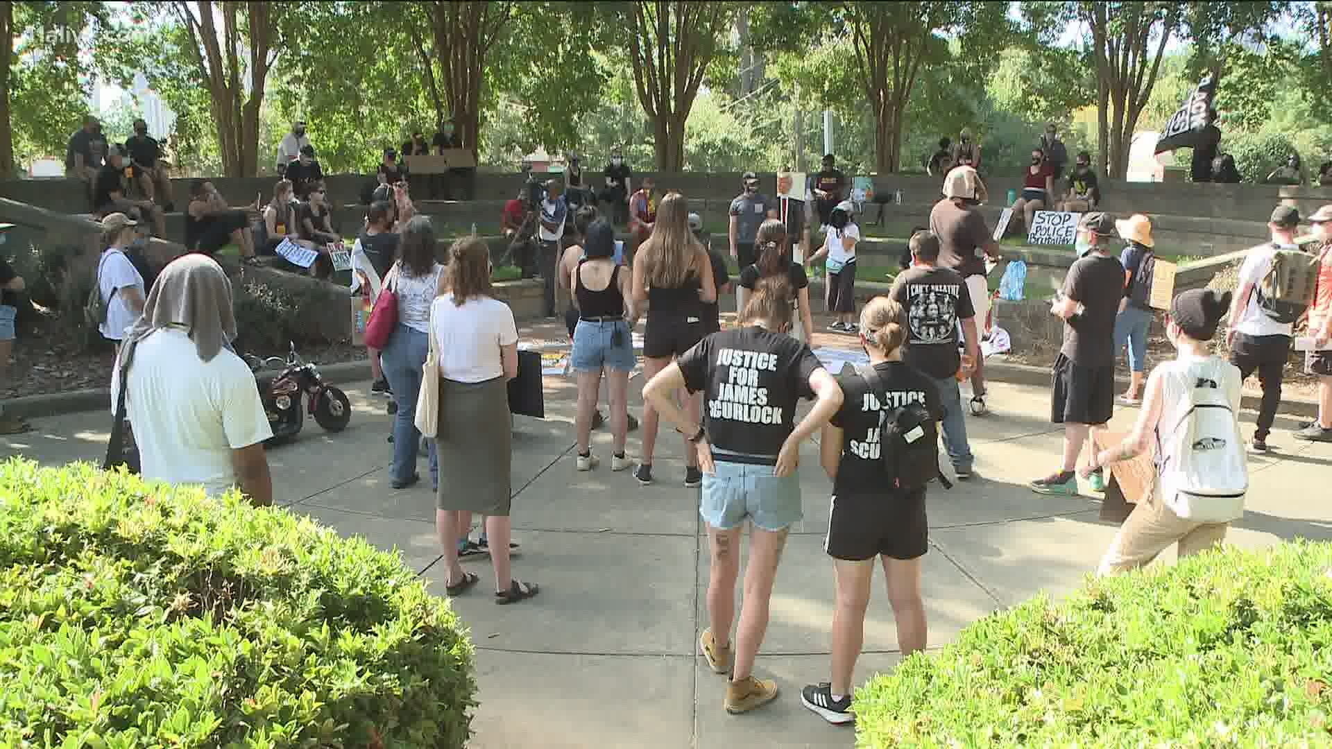 Dozens showed up to Ebenezer Baptist Church as part of an organized protest on Saturday.