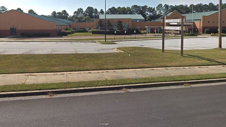 Heritage Elementary School employee carjacked by armed suspect ...