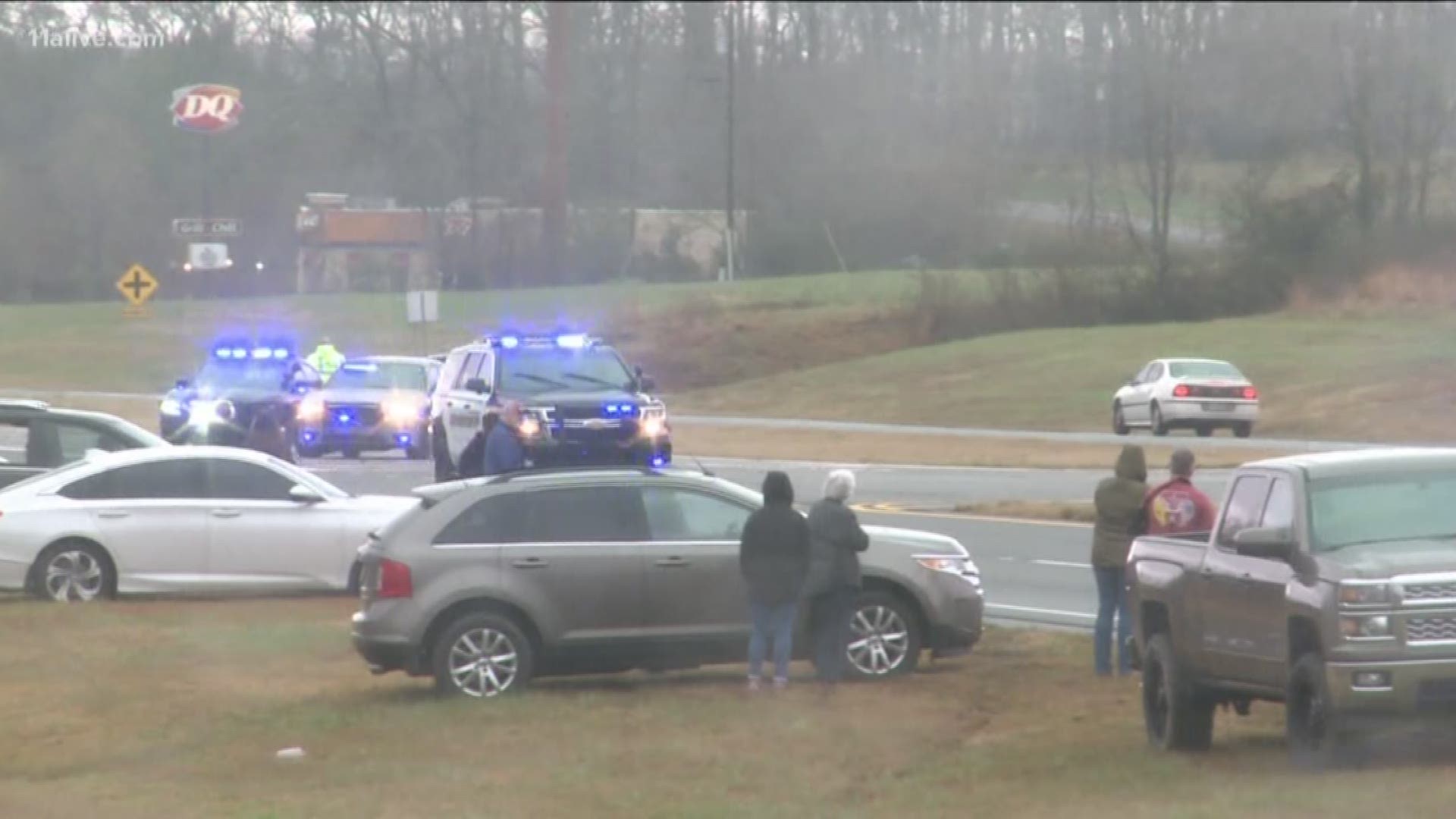 Georgians took to the roadsides to stand in solidarity for an officer shot and killed after a traffic stop in DeKalb County.