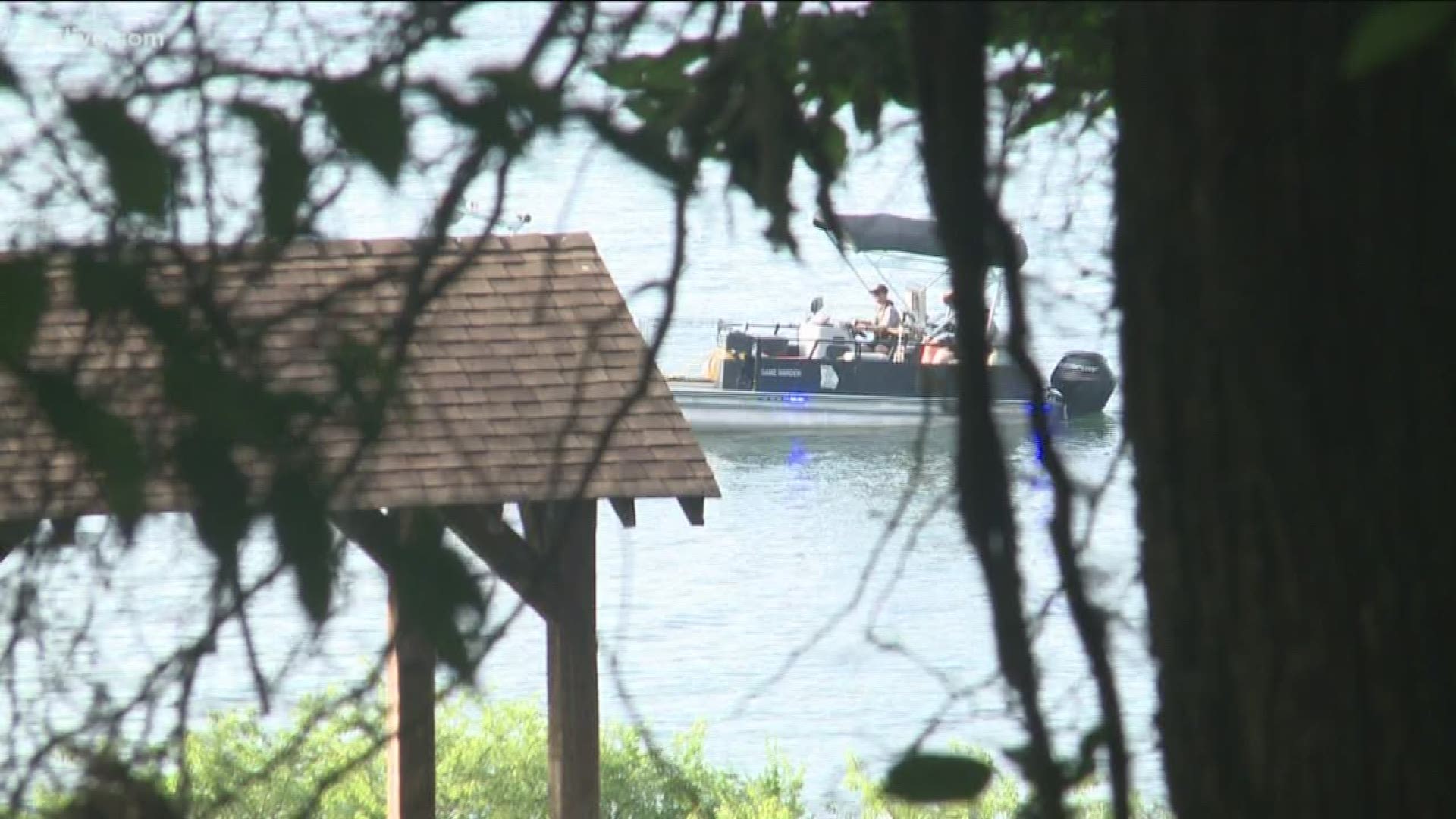 Witnesses say he disappeared in the waters of Lake Lanier while trying to save another swimmer.