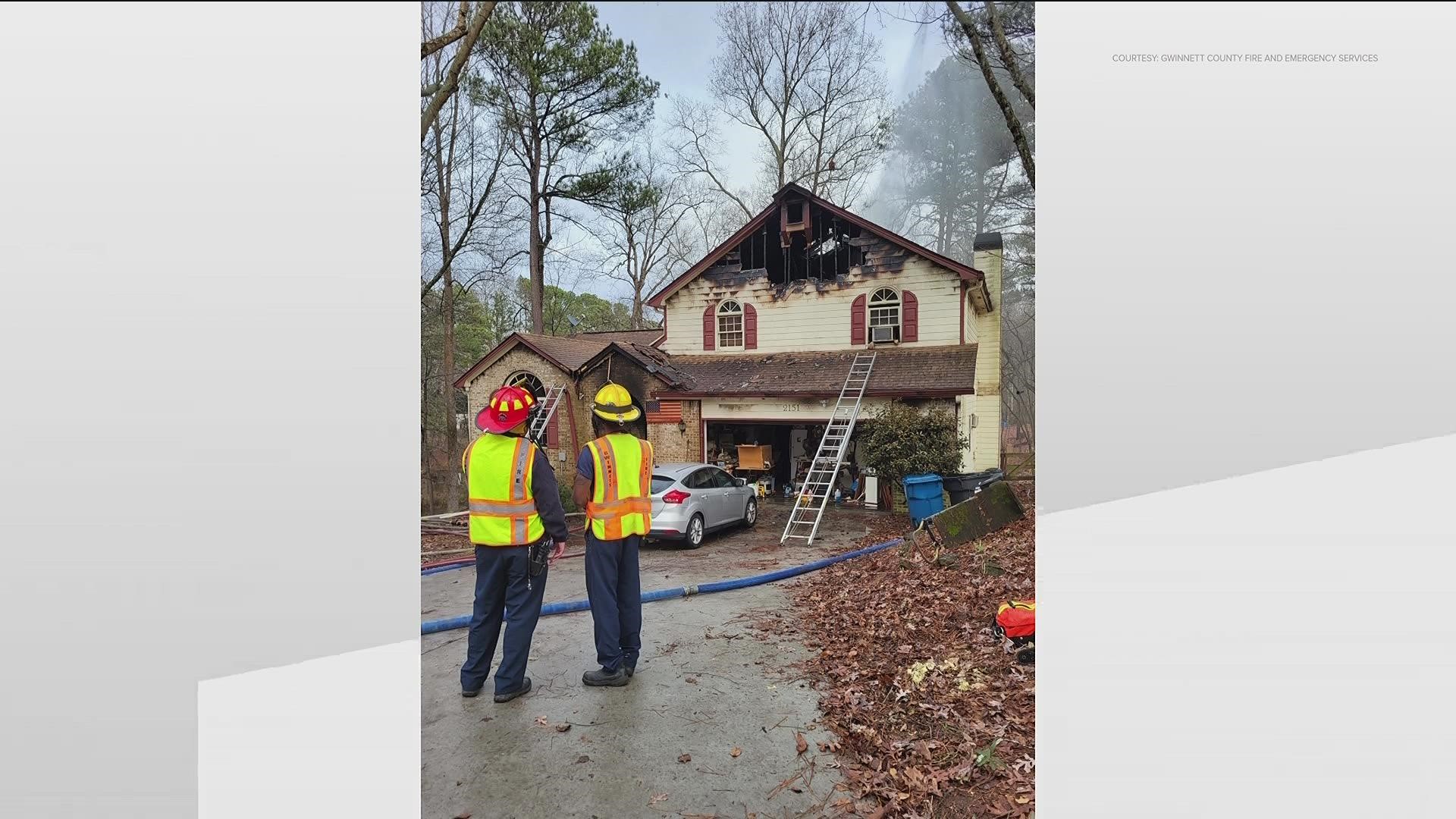 They were able to get out of the burning home on New Year's Eve thanks to their neighbor.