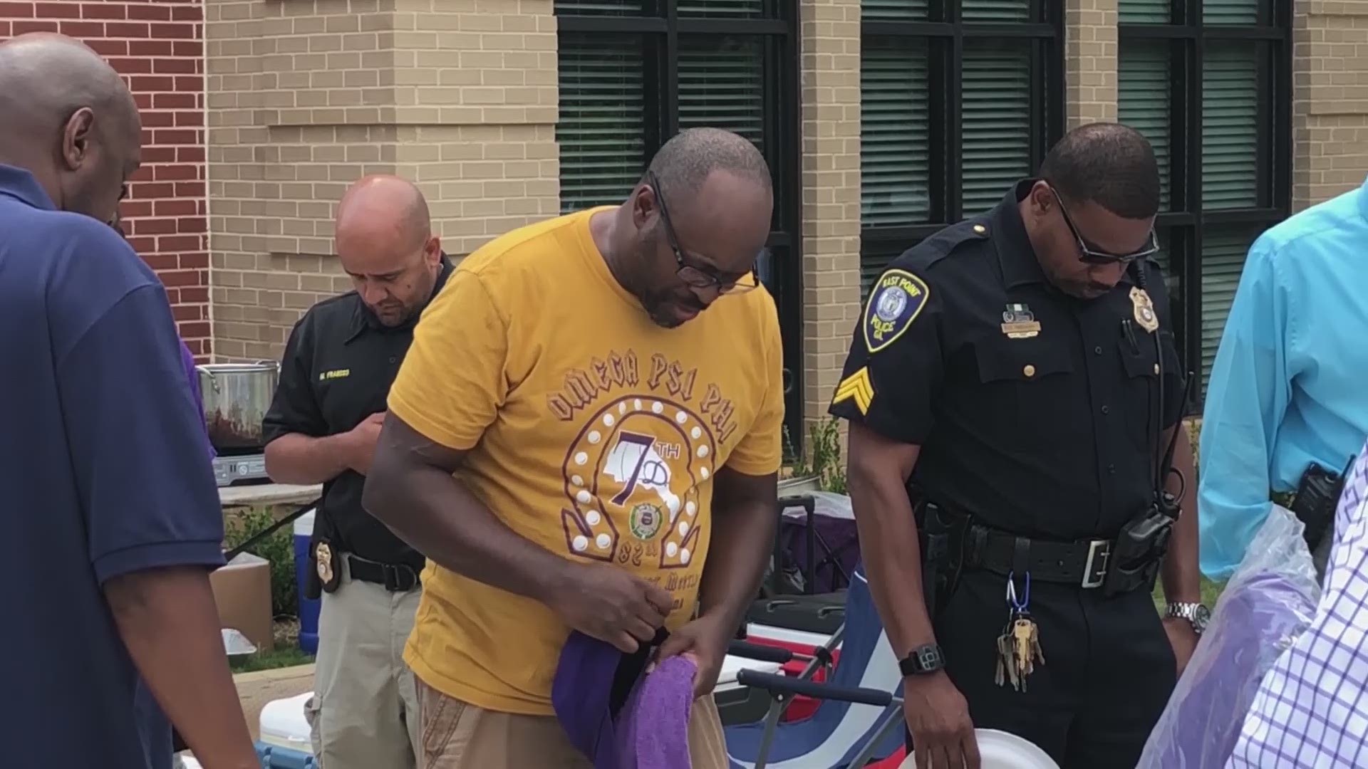 Members of the Omega Psi Phi fraternity show their gratitude