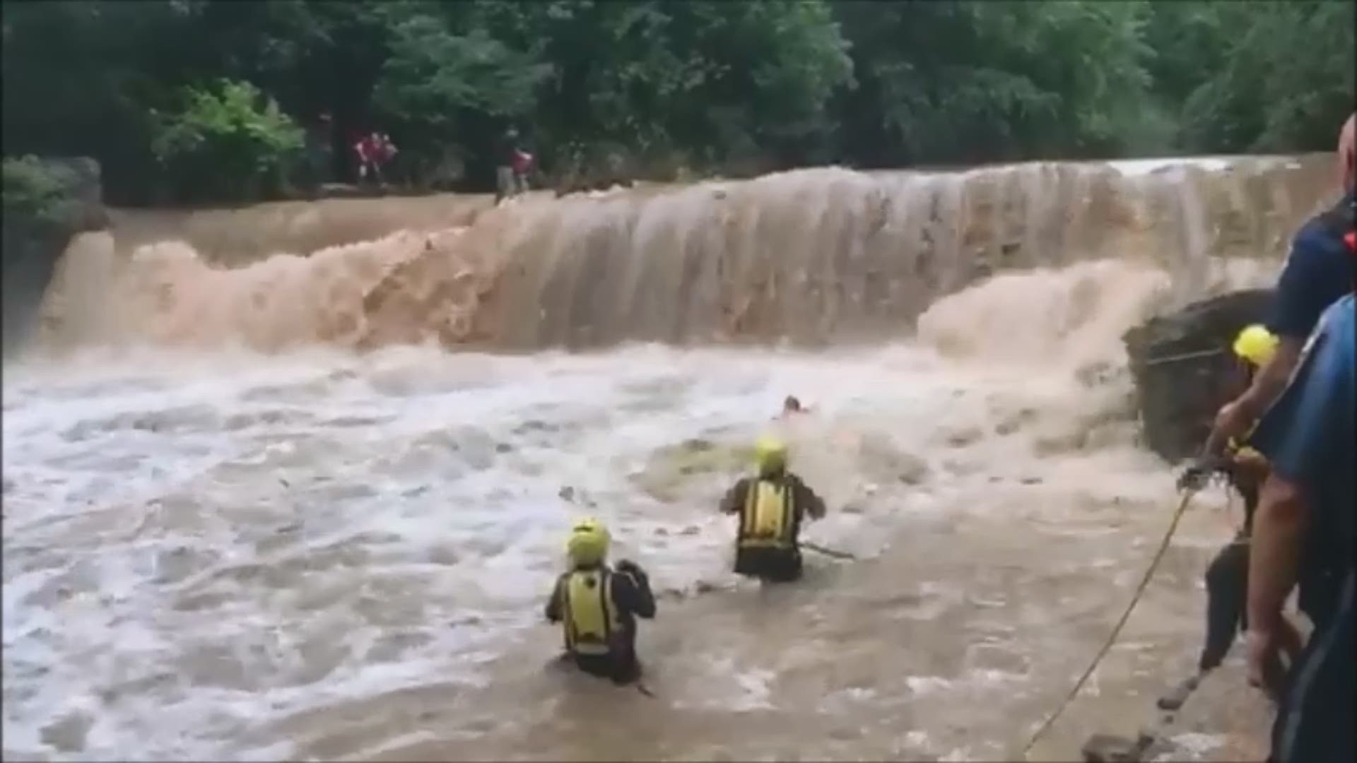 A total of 10 children and one adult, some dangerously close to falling over the falls, were rescued by several first responders in Gwinnett County
