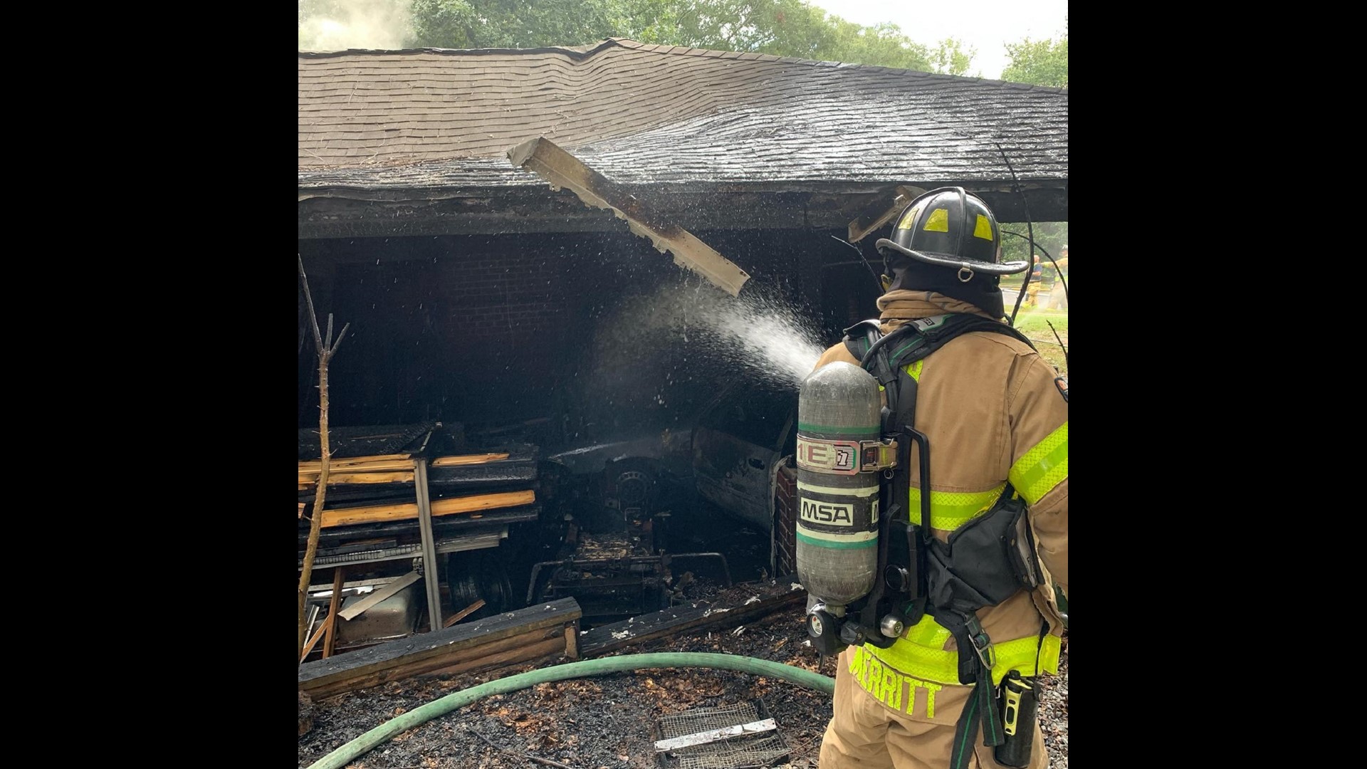 Smyrna house fire burns as officer prays with homeowner