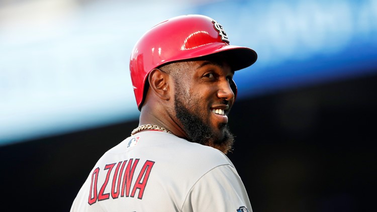 MLB Twitter reacts to fan sporting a customized Marcell Ozuna quote jersey:  I hope this dude ain't driving