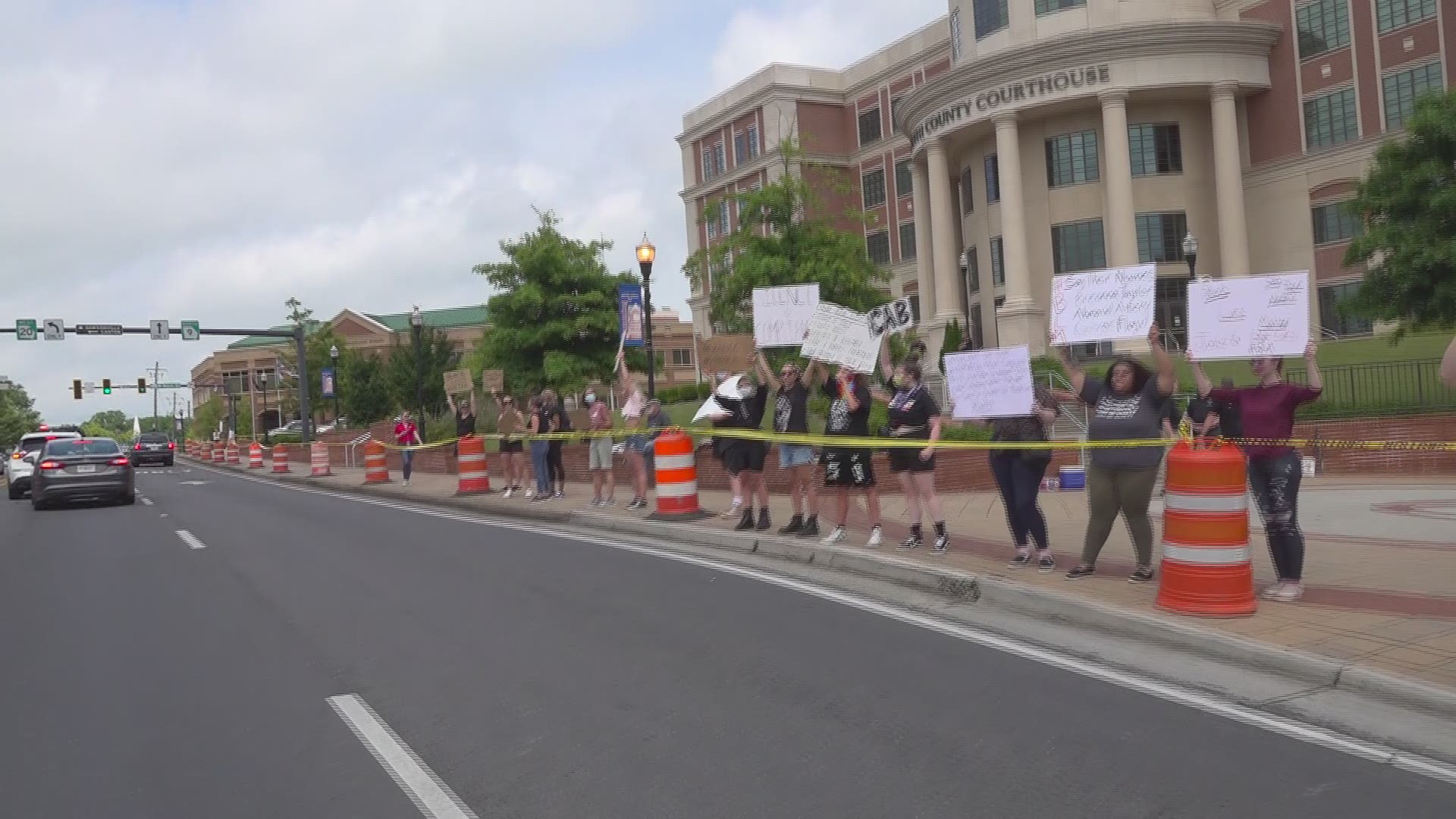 Dozens of people showed up Friday afternoon for the planned protest.