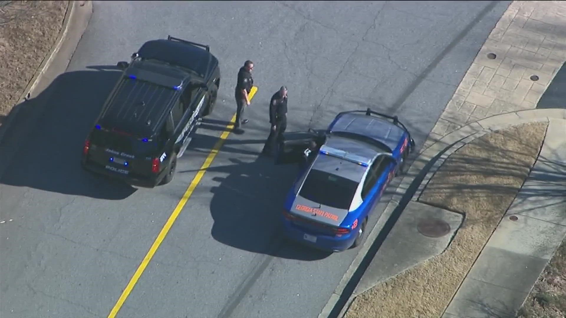 The chase ended on Old Alabama Road in a shopping center, according to a Johns Creek Police social media post.