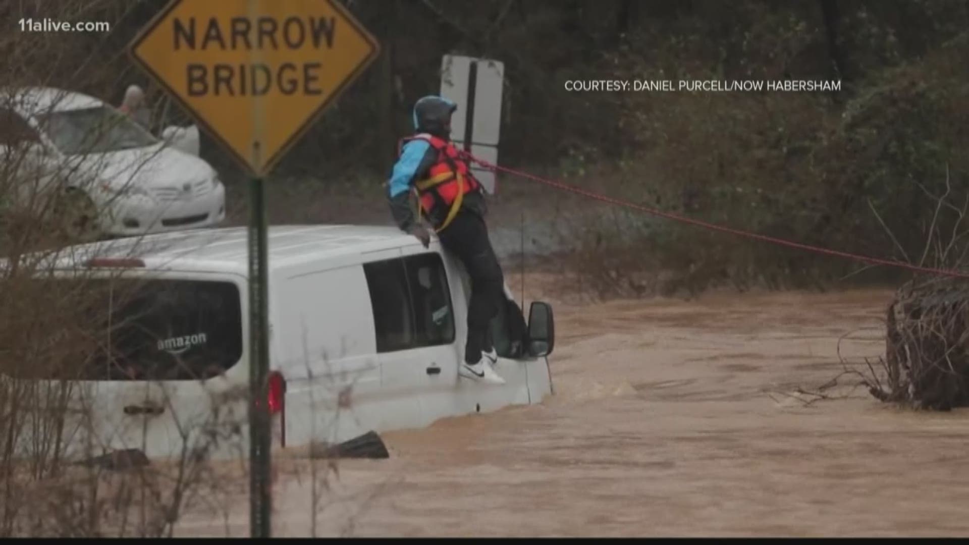 The trip was unsuccessful and the driver ended up awaiting rescuers on top of his van.