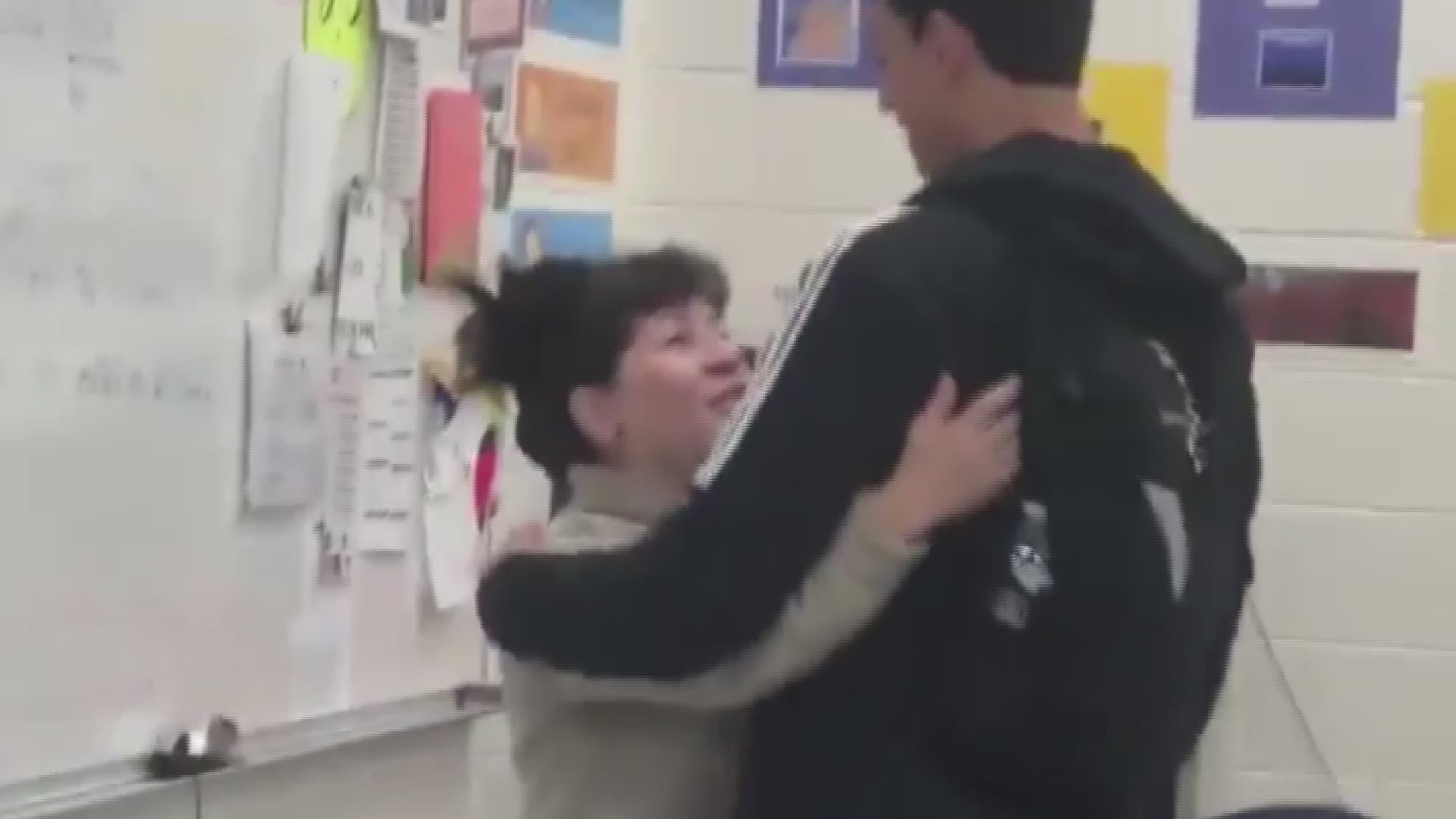Video of students sharing college acceptance with teacher.
