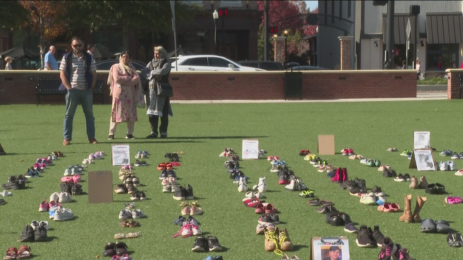 Hundreds of shoes representing thousands of children killed in Gaza region were displayed in Downtown Alpharetta town square.