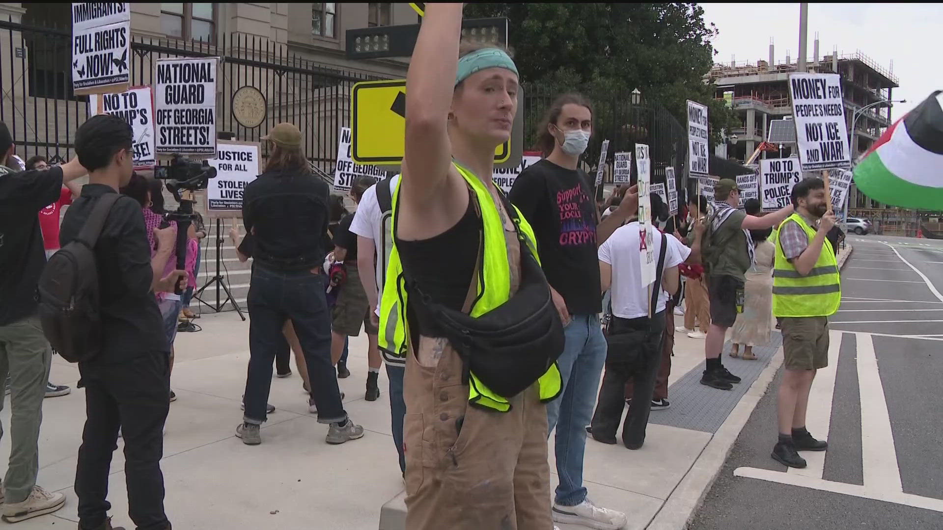 Protesters rally at state Capitol over Kemp's immigration order ...