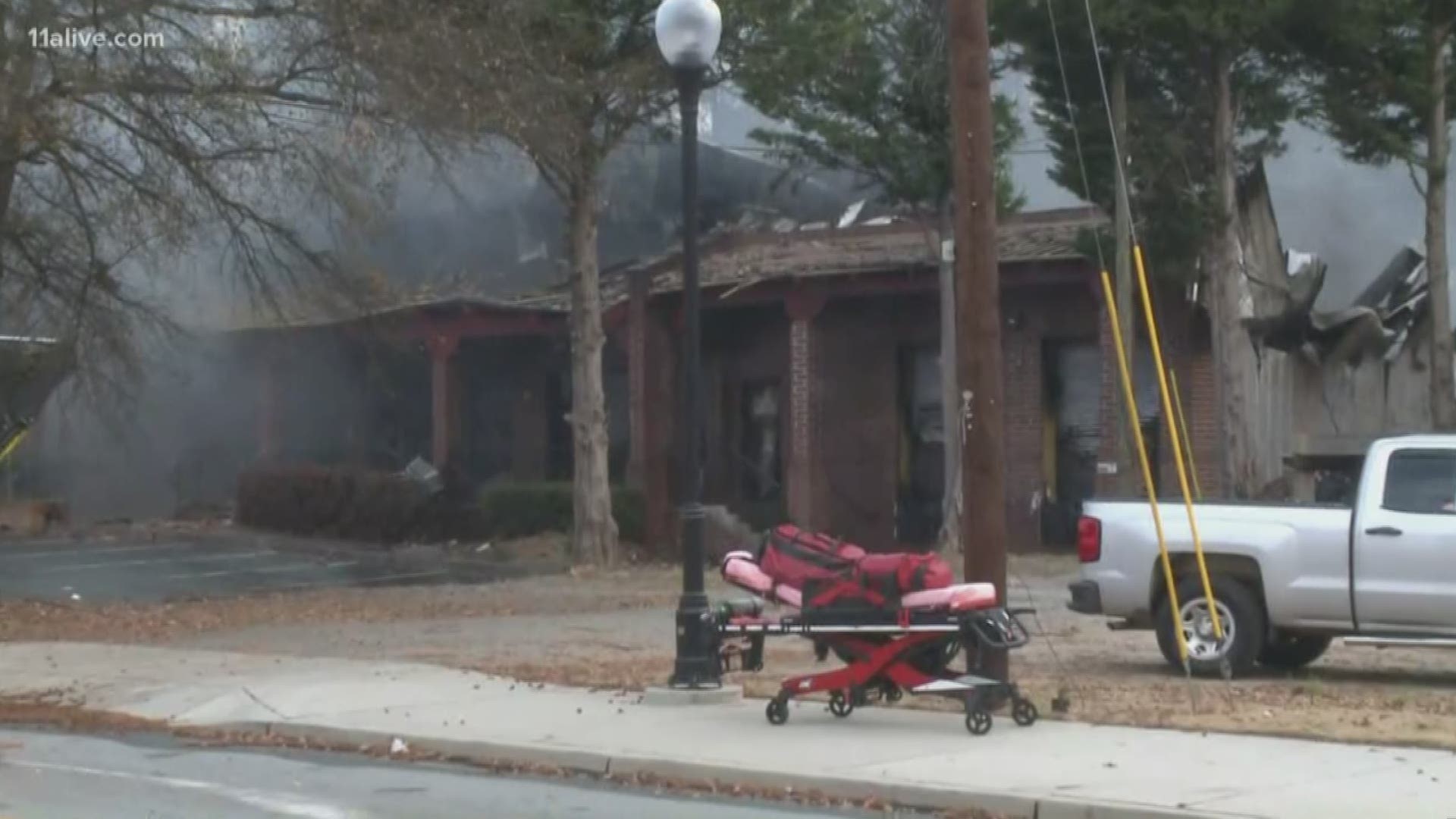 Two people inside a Chamblee business were able to escape before the building on Chamblee-Dunwoody Road burned, DeKalb fire officials said Sunday morning.