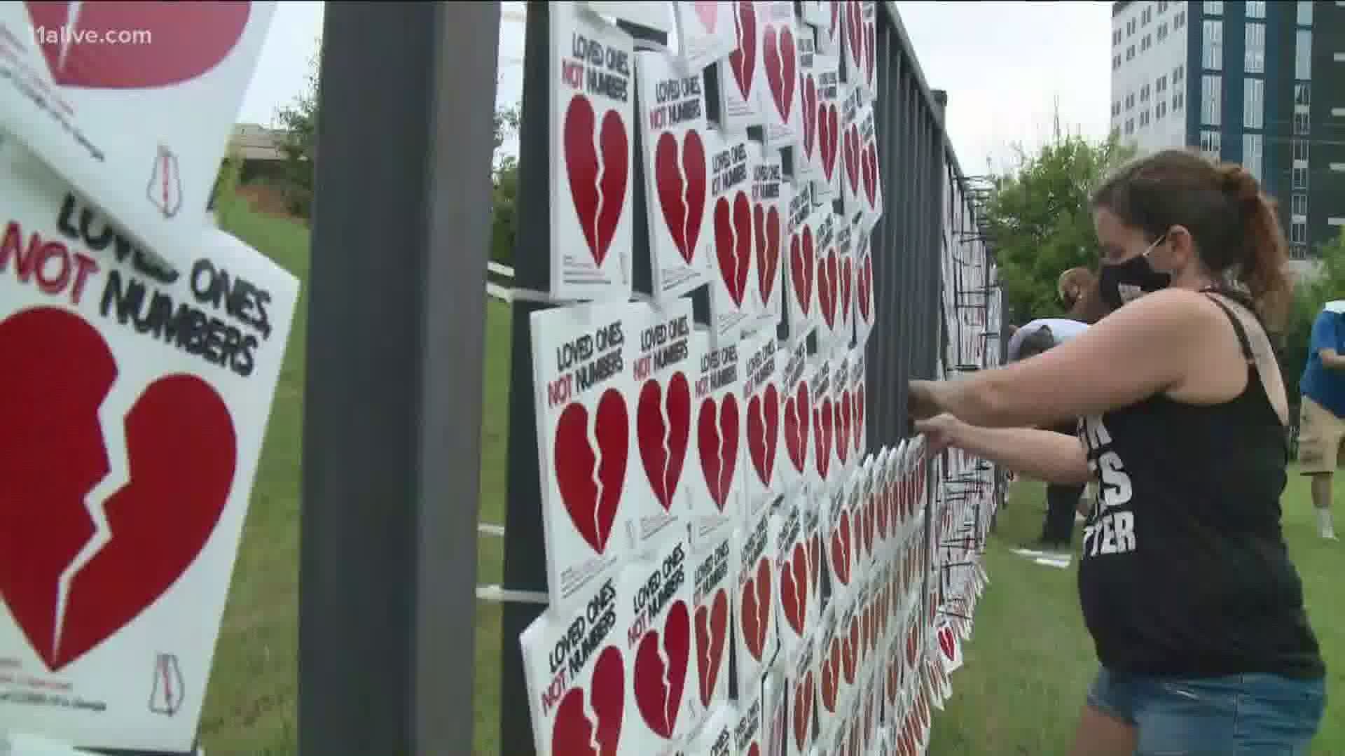 To honor the over 5,000 people who have died from the virus in the state, a makeshift memorial was erected near the Georgia Aquarium.