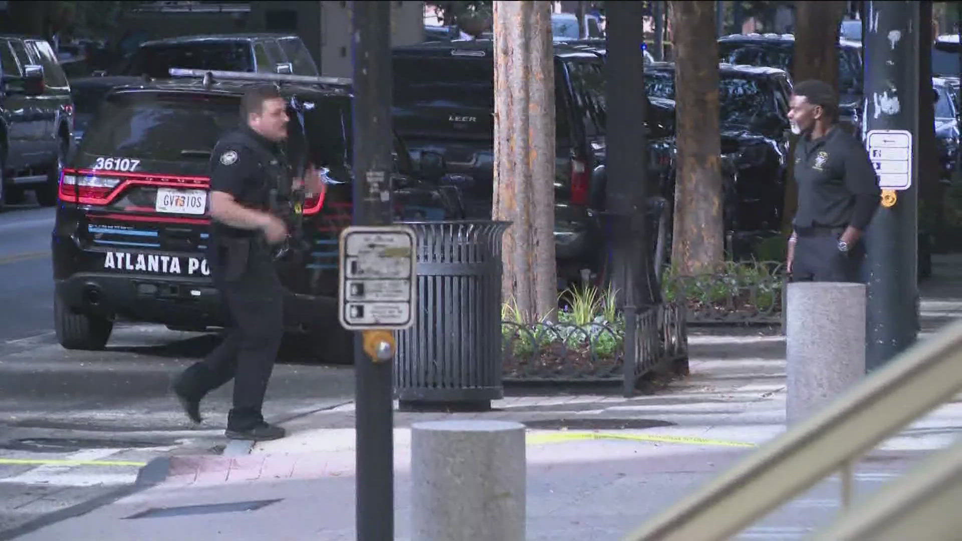 A person has been taken into custody after shots were fired around the busy Four Seasons Hotel in Midtown Atlanta on Tuesday afternoon. 