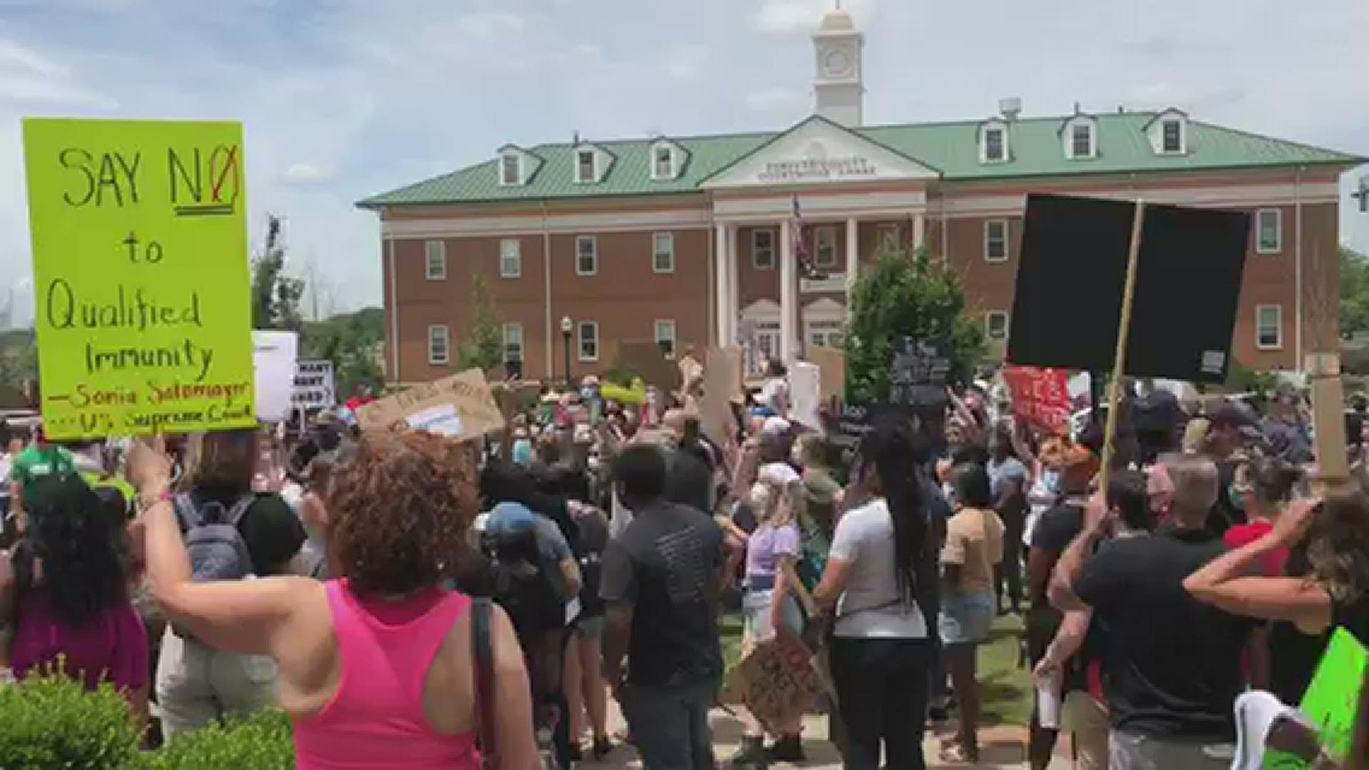 Authorities estimated hundreds of people showed up outside the Forsyth County Courthouse in Cumming on Saturday afternoon.