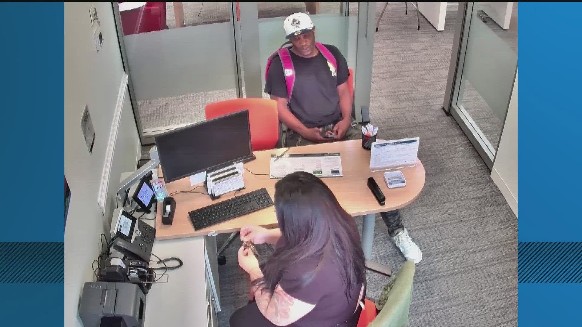 Authorities say the man in the video demanded money on Wednesday, telling an employee to comply or else she'd meet his friend.
