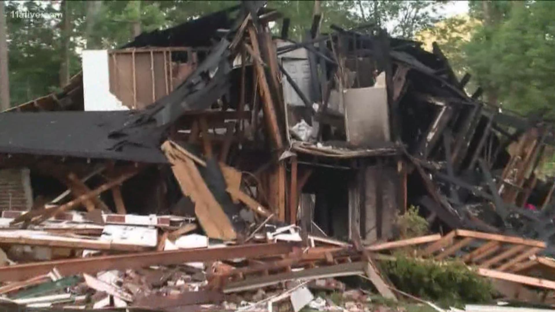 A 6-year-old boy and his father were able to escape the wreckage as their house in Austell collapsed and caught fire in an explosion on Sunday.