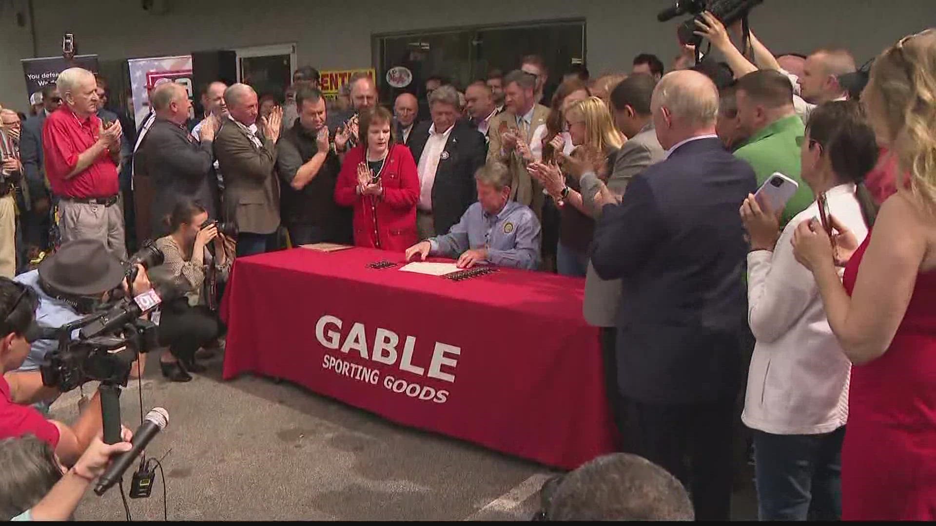 The governor signed a bill and spoke at Gables Gun Shop about how they got the bill across the finish line.