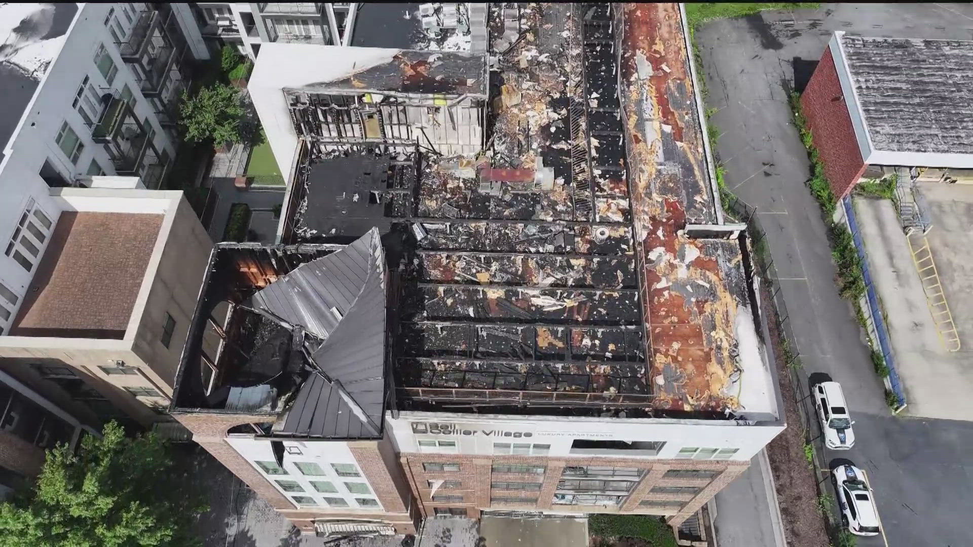 The Bell Collier Village building has been deemed unsafe after this weekend's fire. Security guards and gates mean residents have no access to their belongings.