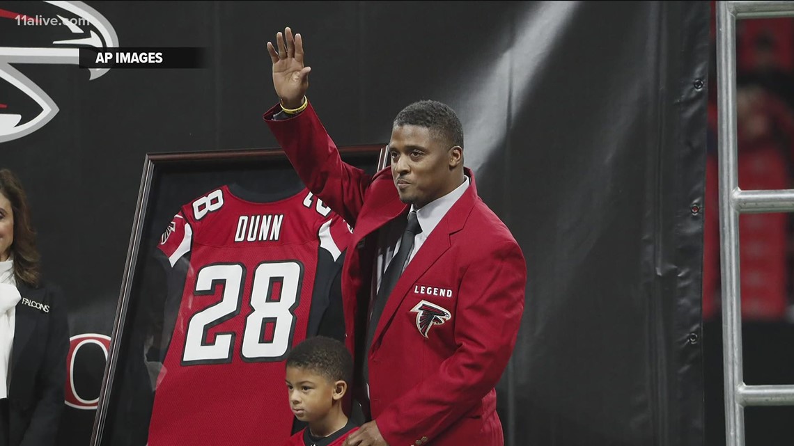 Running back Warrick Dunn of the Atlanta Falcons holds the ball